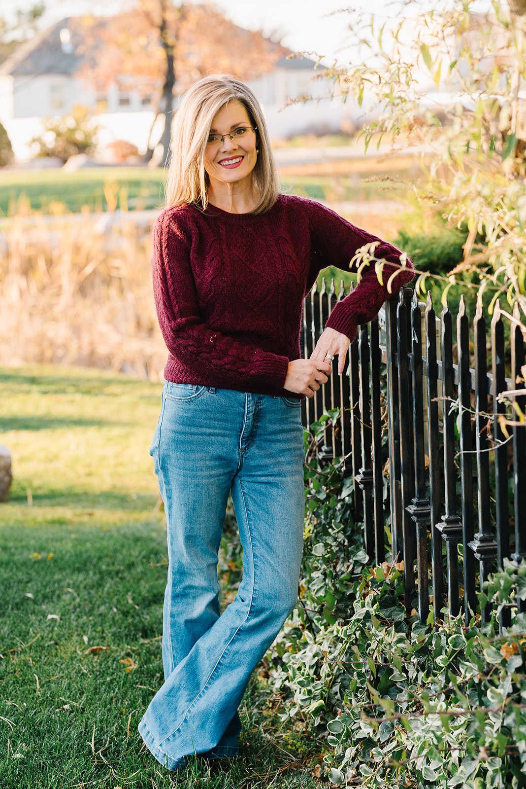 Kara Toone outdoors in burgundy sweater